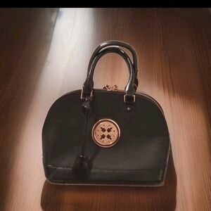 Elegant Black Satchel with Gold Detailing
